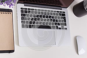 Apple Macbook Pro Retina on a desk with stationery. Mockup for decal, sticker design. Trendy office, freelance workplace
