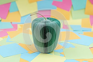 an apple made of sheets of paper with multicolored paper sticky notes