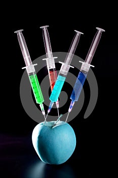 Apple manipulation with syringes