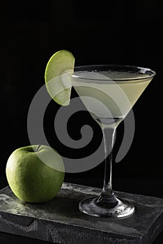 Apple Martini cocktail is on the bar. Space for text. Photo for the menu