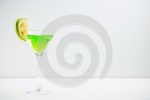 Apple martini cocktail on the white rustic background