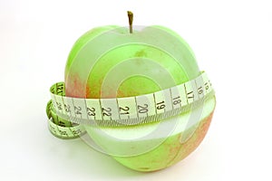 Apple with measure tape photo