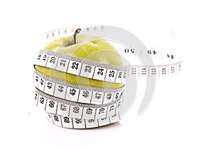 Apple and a measure tape, diet concept