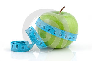 Apple with measuring tape