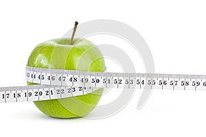 Apple with measuring tape