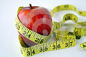 Apple with measuring tape arou