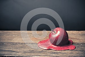 Apple melting on the floor photo