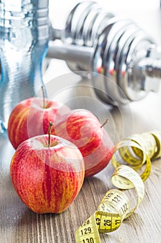 Apple and mesuring tape.