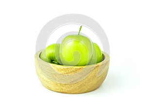 Apple monkey or jujub Zizyphus mauritiana Lam isolated green fruit in wooden cup on white background and clipping path