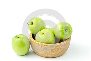 Apple monkey or jujub Zizyphus mauritiana Lam isolated green fruit in wooden cup on white background and clipping path