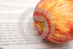 Apple on newspapers background