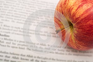 Apple on newspapers background
