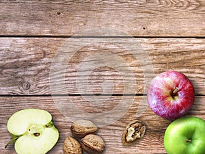 Apple and Nuts Background. Dried walnuts with aple on a wooden background.