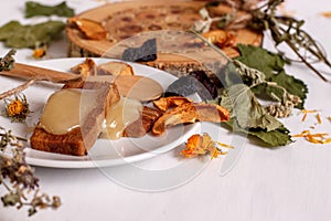Apple pastillas, honey, dried fruit on a white table photo