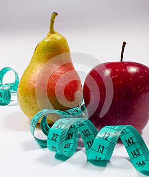 Apple, pear and tape measure, diet concept
