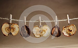 Apple and pears dried with a clothespeg