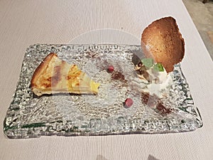 Apple pie dessert served on a square glass disch