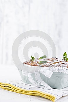 Apple pie in dishes on a white background. Homemade fruit pastries for a delicious breakfast. Free space for text. Copy space