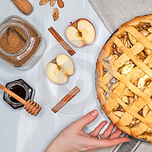 Apple pie, hands, apples, cinnamon, sugar, top view