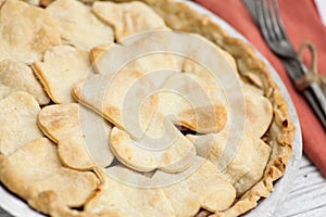 Apple pie with heart shaped crust topping