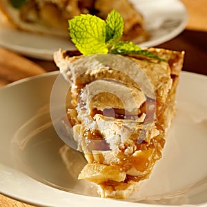 Apple pie with mint garnish.