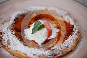 Apple pie on the plate with vanilla ice cream. Restaurant food. Traditional desert.