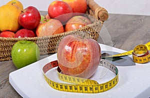 Apple placed on a scales, photo