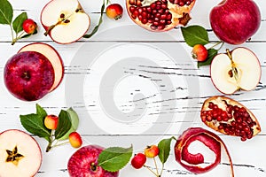 Apple, pomegranate and honey, traditional food of jewish New Year - Rosh Hashana. Copy space background. photo