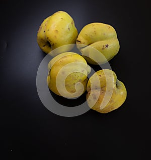 Apple quince om black backround