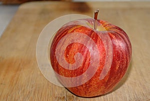 Apple red delicious on a wooden table detail photograph