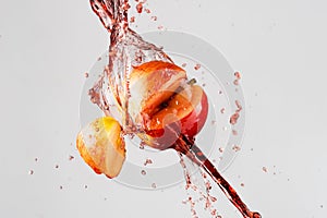 Apple and red juice splash