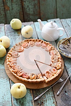 Apple rose pie with cream filling served with organic apples and