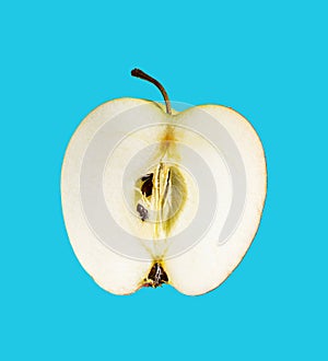 Apple slice isolated on blue background. Clipping path. Full depth of field