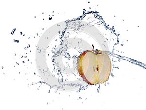 Apple in spray of water. Juicy apple with splash on white ba