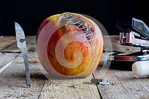Apple with stapler