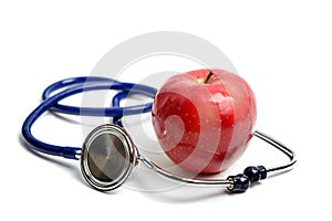 Apple and stethoscope on white