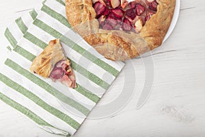 Apple strawberry pie, top view side border against a rustic wood background with copy space. Autumn food concept. Step