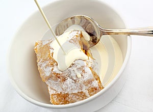 Apple Strudel with cream poured