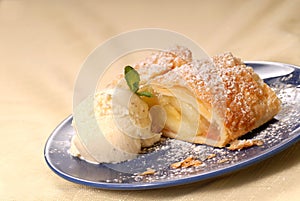 Apple strudel with vanilla ice cream and mint