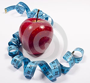 Apple and tape measure, diet concept