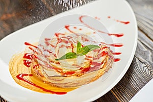 Apple tart with jam flouring with white powder.