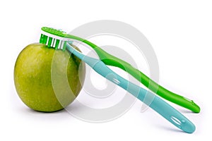 Apple And Toothbrushes - Isolated On White Background