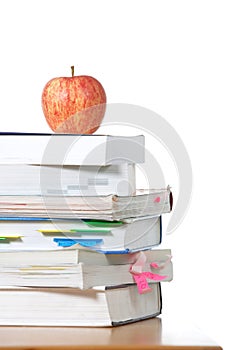 An apple on top of a stack of books