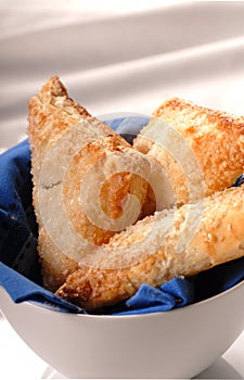 Apple turnovers in a white bowl