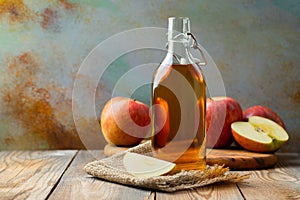 Apple vinegar. Bottle of apple organic vinegar or cider on wooden background. Healthy organic food. With copy space