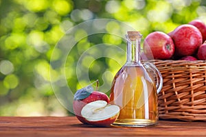 apple vinegar or cider in glass bottle outdoors