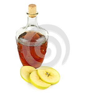 Apple vinegar in glass bottle and ripe apples isolated on white. There is free space for text