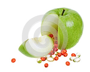 Apple with vitamin capsules