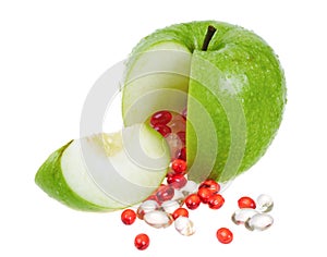 Apple with vitamin capsules