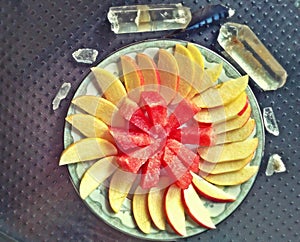 Apple and watermelon on plate